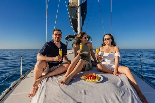 Happy guests on sailboat