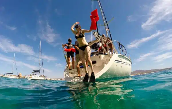 Jumping into the water to snorkel at Pelican Rock