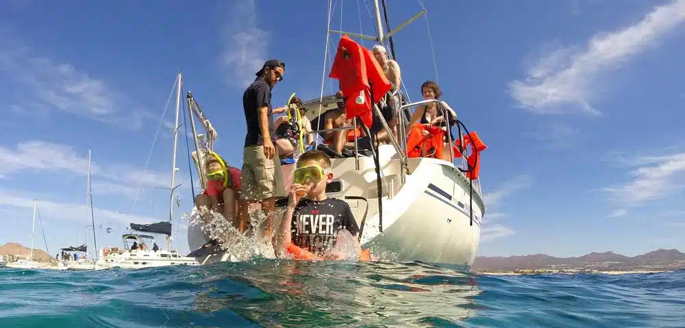 Jumping off the boat to go snorkeling at Chileno Bay